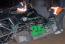 Track workers help prepare for the removal of Shane Clanton's wrecked car Wednesday in Tucson, Ariz. He hit the frontstretch wall leading on lap 12. (Chuck Buchanan)