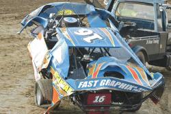 Shawn Negangard's car was heavily damaged in a flip. (tandsracingphotos.com)