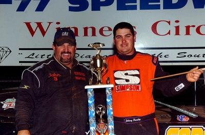 Runner-up John Pursley joins his winning son in victory lane. (George 