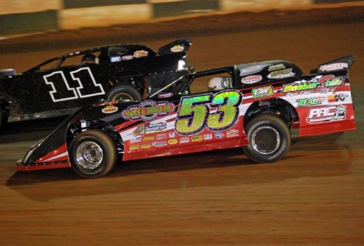 Ray Cook (53) puts a lap on Ryan Law (11) at Green Valley. (DirtonDirt.com)