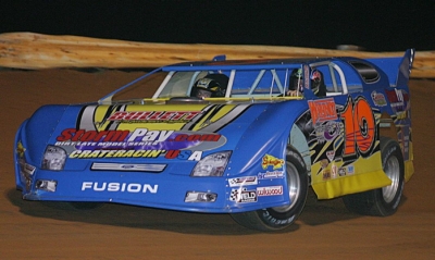 Whynot promoter Rodney Wing gives a two-seater ride in 2006. (Howard Martin)