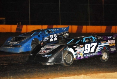 Greg Walters (97) battled car owner Jimmy Schram (22) lap after lap before taking control on lap 31. (Steve Reeck)