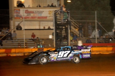 Greg Walters takes the checkers after winning the 67-lap feature. (Steve Reeck)