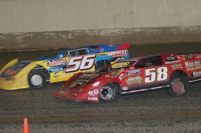 Andy Eckrich (56) and Ray Guss Jr. (58) battle on the final lap. (Barry Johnson)