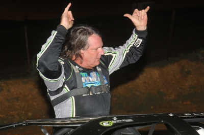 Scott Bloomquist emerges from his car to a mixture of boos and cheers. (Travis Trussell)