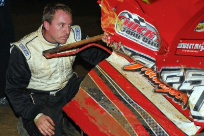 Luke Roffers checks out the damage to his car at Dublin Motor Speedway. (focusedonracing.com)