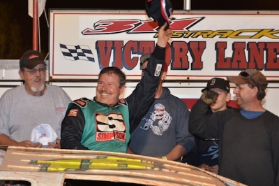 Jeff Smith doffs his cap in victory lane at 311 Motor Speedway. (Gary Laster)