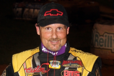 Billy Ogle Jr. smiles in victory lane at 411 Motor Speedway. (Chad Wells)