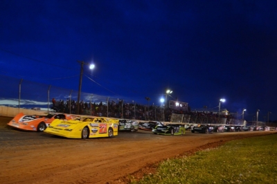The field forms just after dusk at Florence Speedway. (sraracingphotos.com)