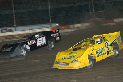 George Lee (61) rides the high side to victory at Hilltop Speedway. (Diane Bemiller)