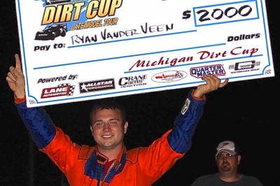 Ryan VanderVeen shows off his $2,000 winner's paycheck. (Jim DenHamer)