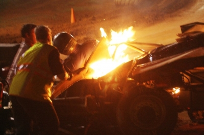 Safety workers help Michael Smith out of his burning car in Lawndale, N.C. (ZSK Photography)