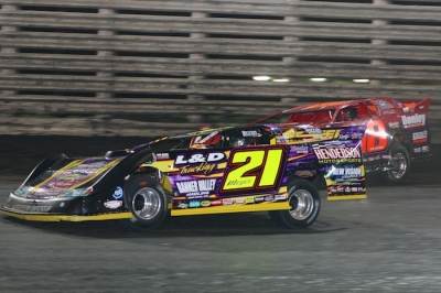 Billy Moyer (21) takes the lead from Shannon Babb on the eighth lap. (Barry Johnson)