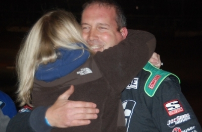 Shane Clanton gets a hug from wife Michelle after winning at Screven. (DirtonDirt.com)