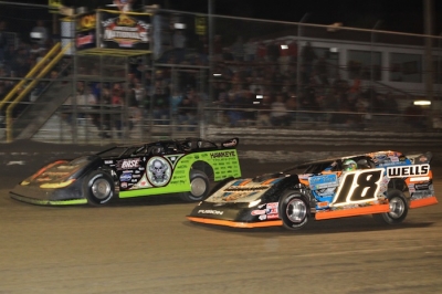 Scott Bloomquist (0) takes the lead from Eric Wells (18) on lap 37. (stlracingphotos.com)