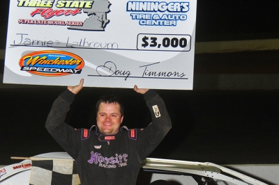 Jamie Lathroum shows off his earnings at Winchester. (Travis Trussell)