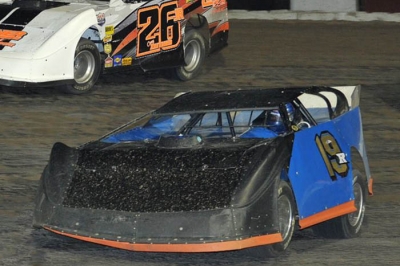 Ryan Gustin 19r) races to victory over Corey Zeitner (26) at 81 Speedway. (Randy Lane)