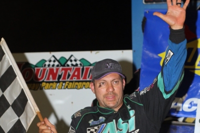 Chris Madden waves in victory lane. (Chad Wells)