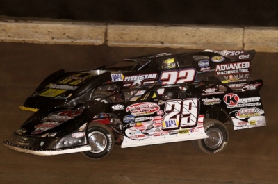 Darrell Lanigan (29) takes the lead from Chris Simpson (32) on the 10th lap. (Scott Swenson)