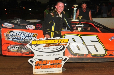Rodney Walls enjoys victory lane at Winchester. (Travis Trussell)