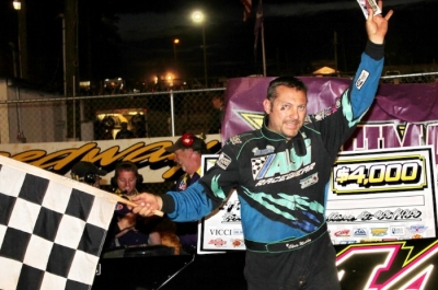 Chris Madden waves in victory lane. (Howard Lawson)