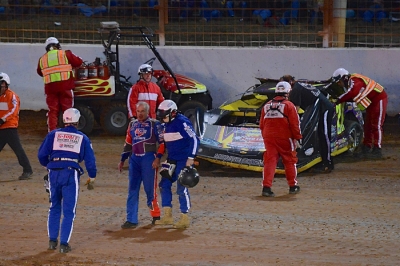Billy Moyer is helped to the ambulance after his Nov. 1 wreck at Charlotte. (dt52photos.com)