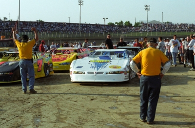 Earl Baltes looks over cars in the infield. (rickschwalliephotos.com)