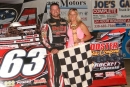 Doug Drown and his wife Joy visit victory lane May 18 at Hilltop Speedway in Millersburg, Ohio after his first career ADRA victory. (Diane Bemiller)