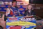 Jonathan Davenport picks up the $10,000 winner's check for the second straight year at the Fastrak-sanctioned Modoc 100 for Crate Late Models. (stonesracingphotos.smugmug.com)