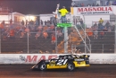 Billy Moyer Jr. takes the checkers Sept. 22 at Magnolia Motor Speedway in Columbus, Miss., for his Comp Cams Super Dirt Series victory in the weekend opener. (Zackary Washington/Simple Moments Photography)
