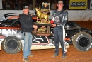 Jonathan Davenport receives his trophy from promoter Vic Hill after winning April 18's 60-lap Gauntlet finale at Volunteer Speedway in Bulls Gap, Tenn. (mrmracing.net)