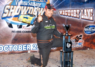 Madden enjoys victory lane. (World of Outlaws)