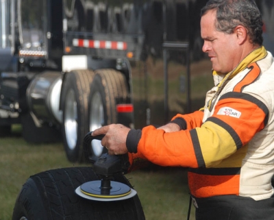 Gar Dickson prepares a tire for Sunday's National 100 at East Alabama Motor Speedway. (DirtonDirt.com)