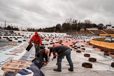 Putting tarps on Senoia Raceway. (facebook.com/SenoiaRaceway1969)