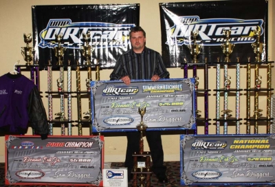 Dennis Erb Jr. shows off some of his awards. (stlracingphotos.com)