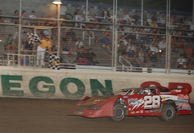Jimmy Whisler takes the checkered flags. (photofinishphotos.com)