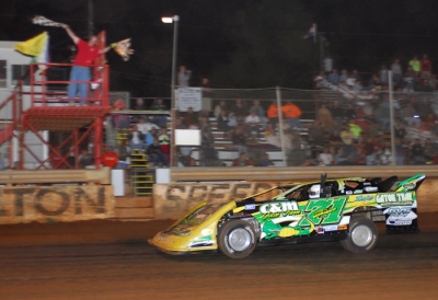 Chris Wall takes $3,000 worth of checkered flags. (Sherry Kiser)