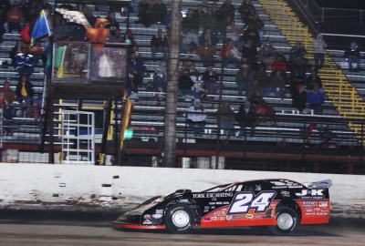 Rick Eckert takes the checkers. (ronskinnerphotos.com)