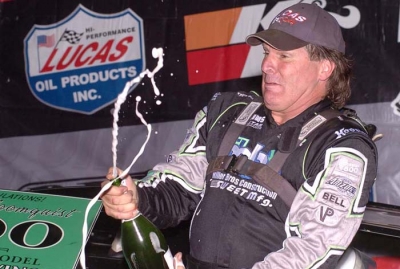 Scott Bloomquist breaks out the bubbly. (Eric Thompson)