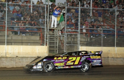 Billy Moyer takes the checkers June 2 in Highland, Ill. (stlracingphotos.com)