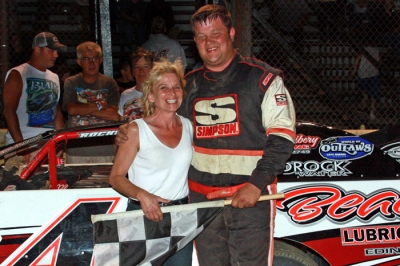 Dave Hess Jr. is joined in victory lane by Jenifer Seamens, widow of former Stateline Speedway owner Fritz Seamens. (Bill Galford)