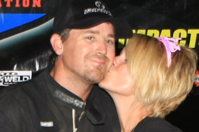 Nicki Looney kisses husband Brad after his $3,000 victory. (cbracephotos.com)