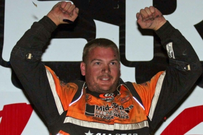 Brady Smith celebrates atop his Bloomquist Race Car. (Steve Datema)
