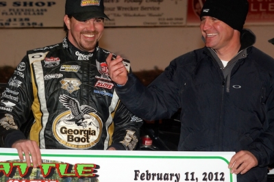 Jonathan Davenport (left) and car owner Clint Bowyer enjoy victory lane. (DirtonDirt.com)