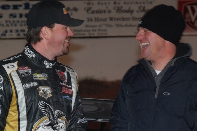 Jonathan Davenport (left) and Clint Bowyer (right) share a laugh in victory lane. (DirtonDirt.com)