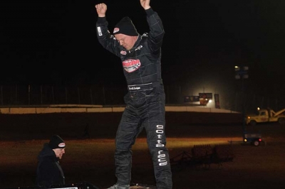 Darrell Lanigan climbed atop his race car after his $20,000 victory. (Heather Rhoades)