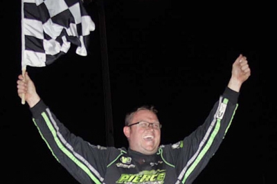 Jason Feger celebrates his $10,000 victory. (Jim DenHamer)