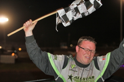 Jason Feger celebrates after leading the final two laps at Farmer City. (Jeff Hall)
