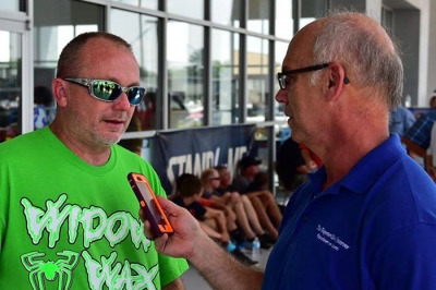 Jimmy Owens (left) talks to reporter Thomas Pope. (Lucas Oil Series)