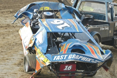 Shawn Negangard's car was heavily damaged in a flip. (tandsracingphotos.com)